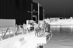 squam-creative-teele-warehouses-gloucester-harbor-bw-inversion