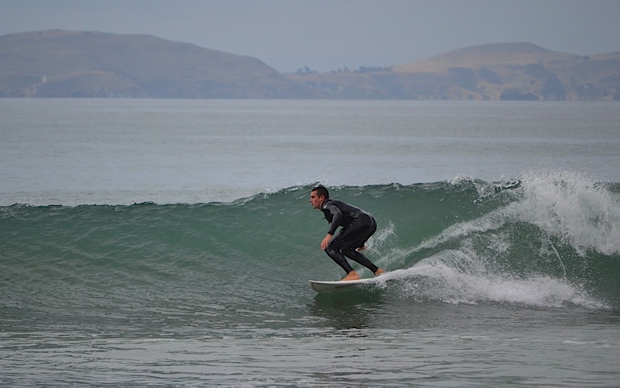 Surfing, Karitane Beach, New Zealand